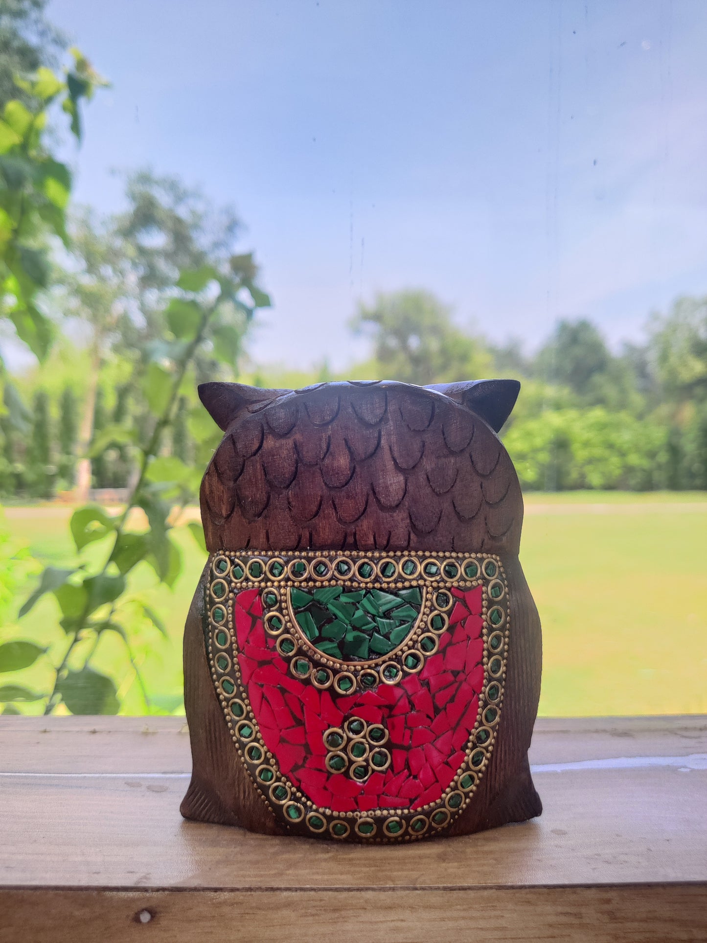 Wooden owl with stone work