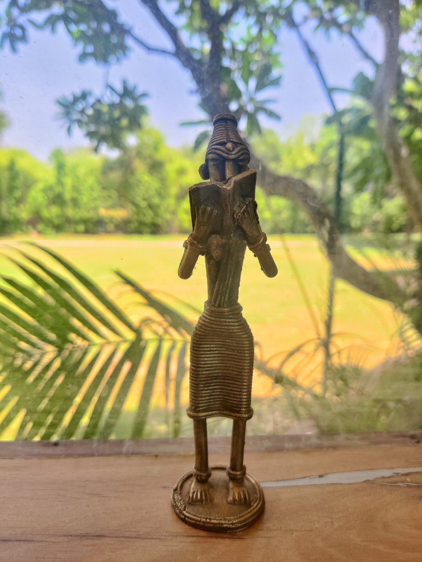 Tribal book reading figure