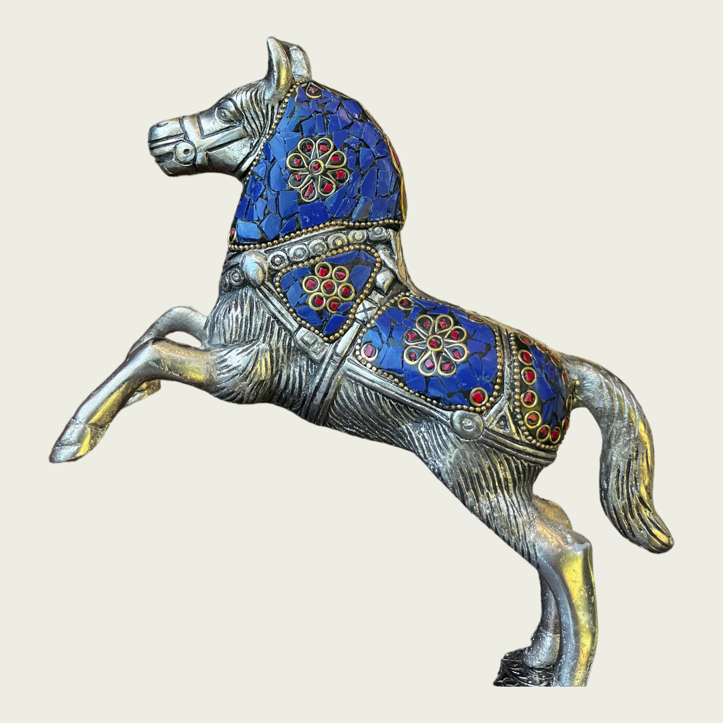 Metal jumping horse with stone