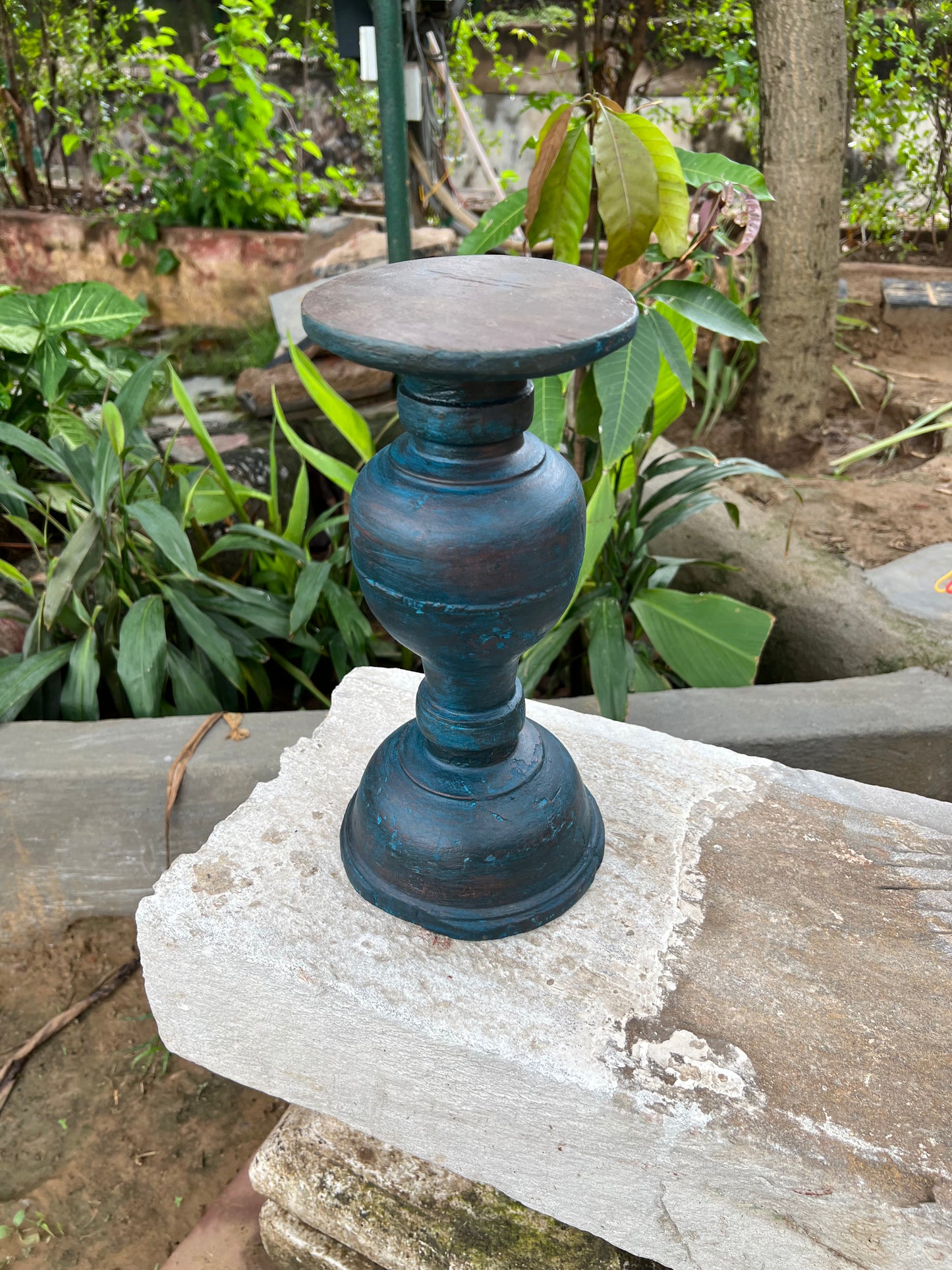 Image of Elegant and Traditional Wooden Stand Candle Holder. The Source India is an Indian Handicraft, Home Decor, Furnishing and Textiles Store. Based out of Hauz Khas Village New Delhi, each piece is carefully procured to allow the enhancement of India's Culture.