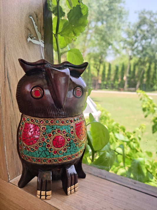 Wooden owl with stone work