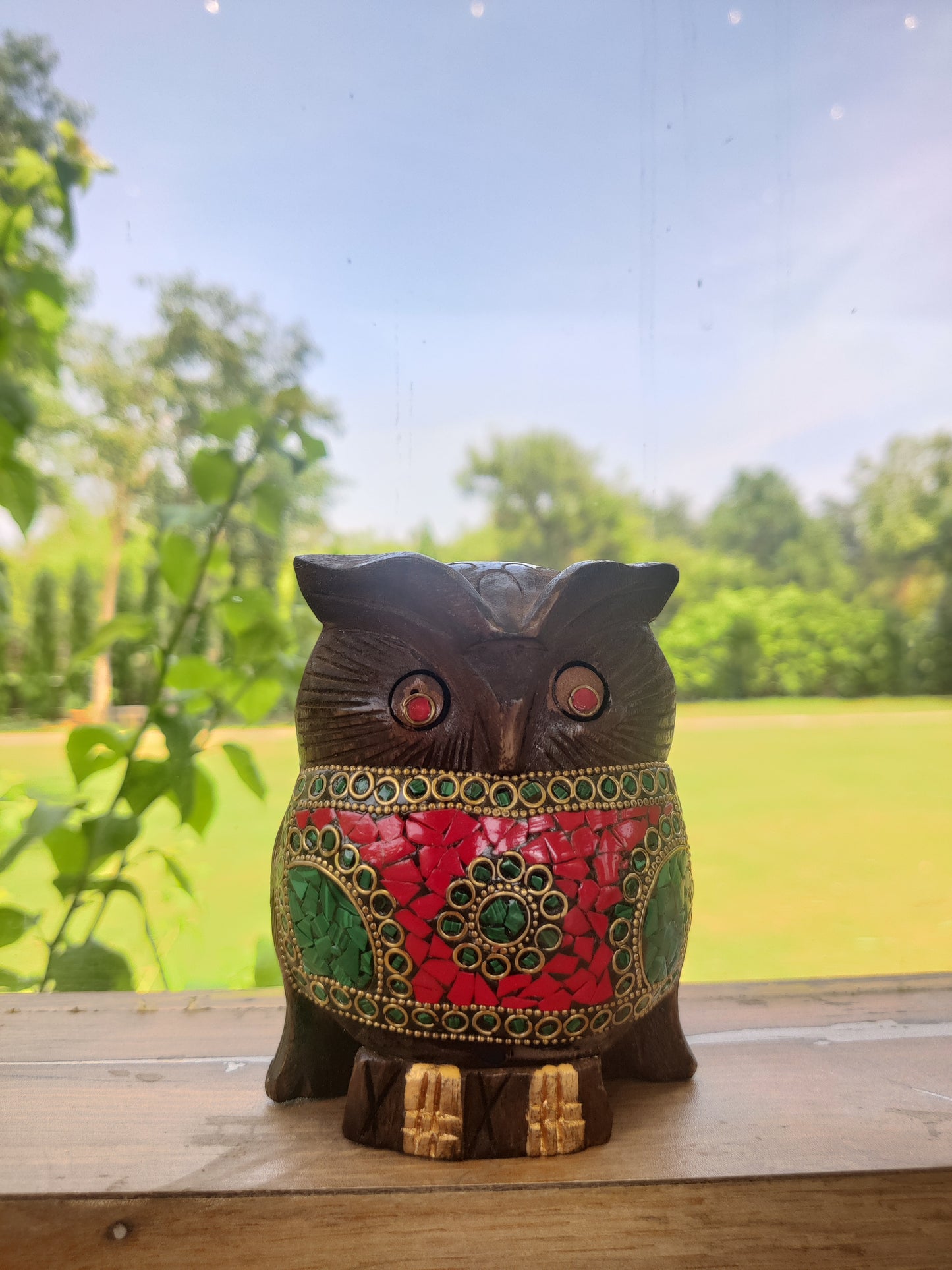 Wooden owl with stone work