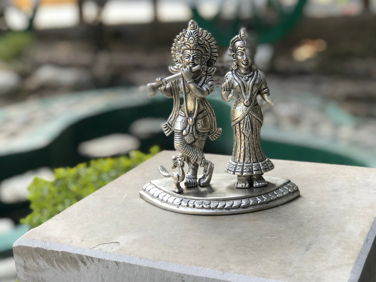 Image of Elegant and Traditional Brass Radha Krishna in Silver Finish.  The Source India is an Indian Handicraft, Home Decor, Furnishing and Textiles Store. Based out of Hauz Khas Village New Delhi, each piece is carefully procured to allow the enhancement of India's Culture.