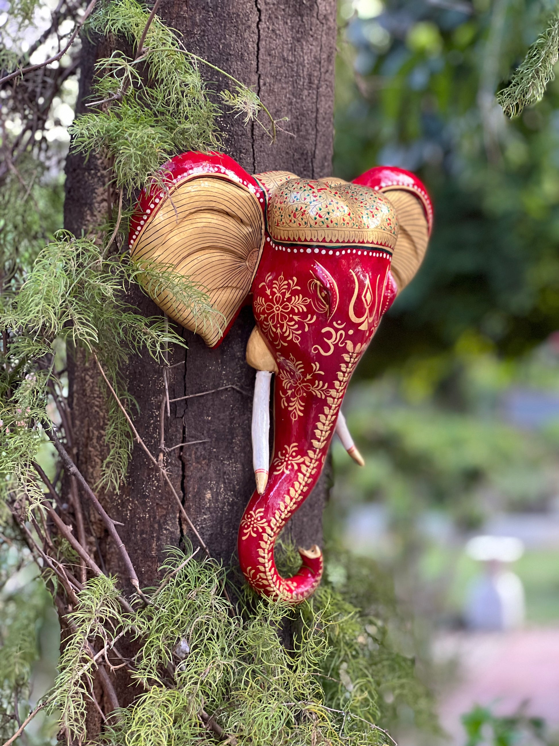 Image of Wooden Hand Painted Red Ganesha Face The Source India is an Indian Handicraft, Home Decor, Furnishing and Textiles Store. Based out of Hauz Khas Village New Delhi, each piece is carefully procured to allow the enhancement of India's Culture.