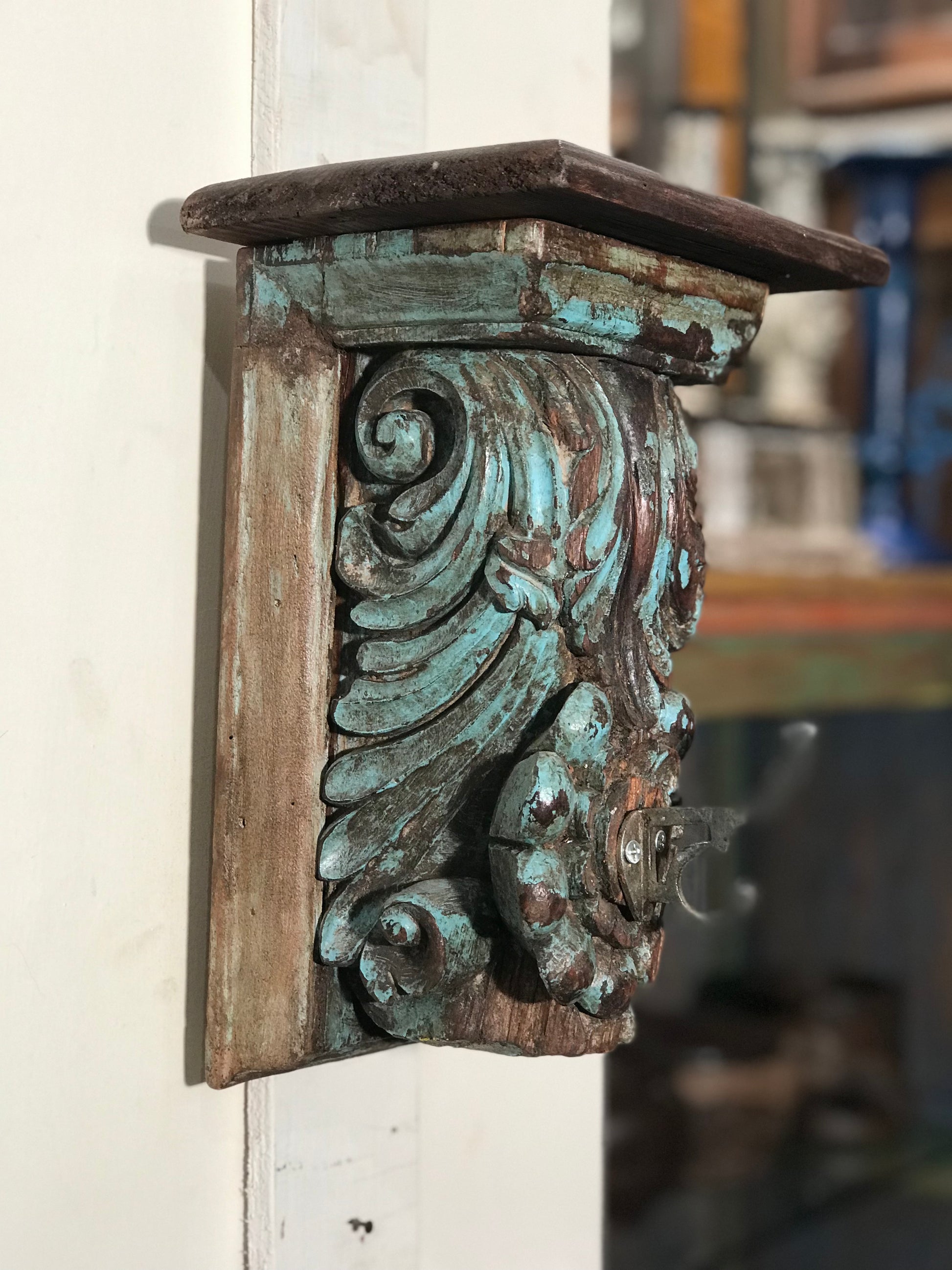 Image of Elegant and Traditional Rustic Blue Carved old Bracket  The Source India is an Indian Handicraft, Home Decor, Furnishing and Textiles Store. Based out of Hauz Khas Village New Delhi, each piece is carefully procured to allow the enhancement of India's Culture. 
